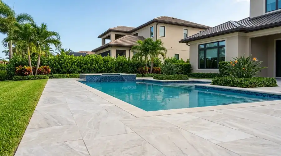 Large-format porcelain pavers and coping at a Naples, FL pool